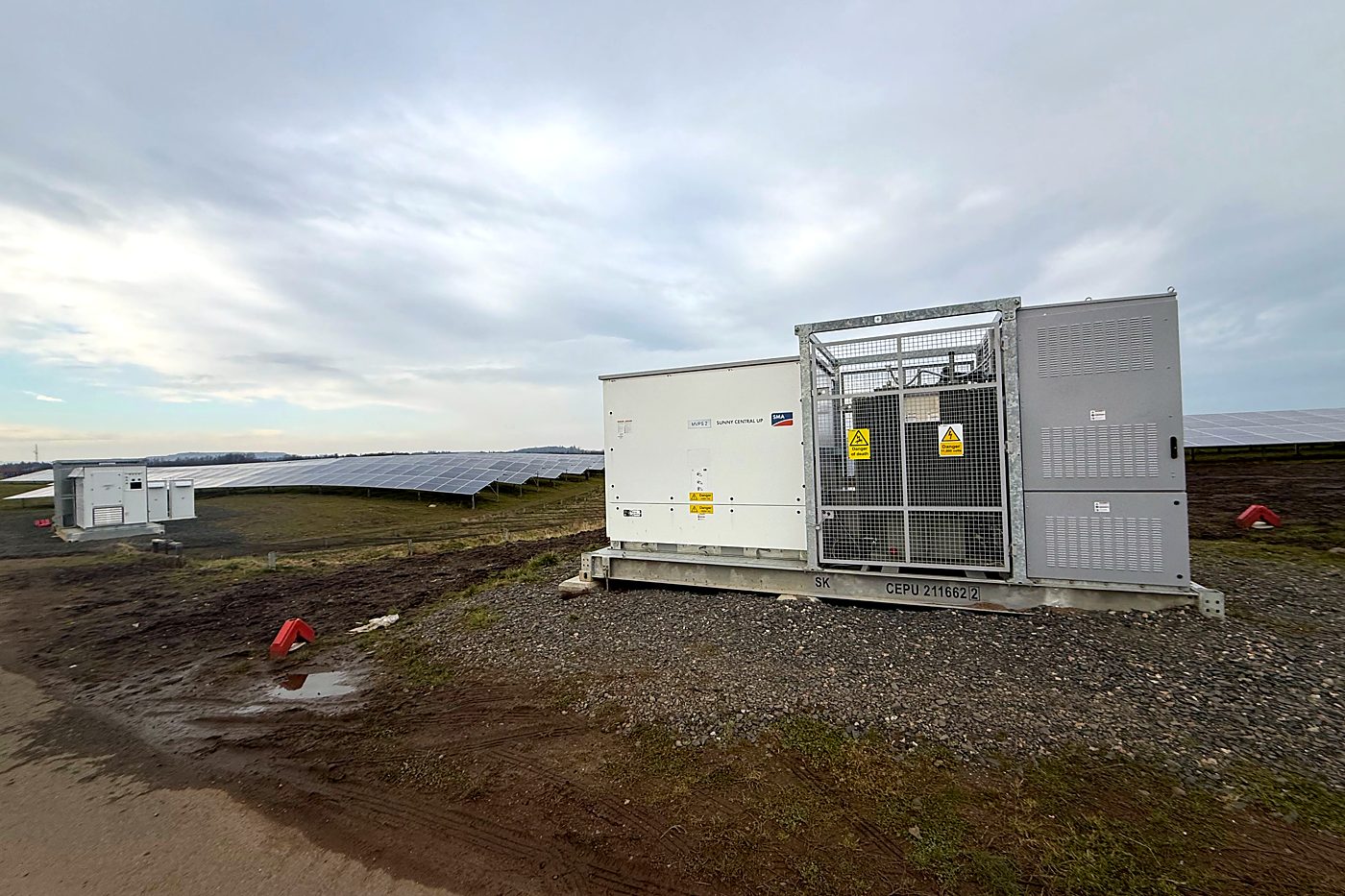 Battery container beside a solar array